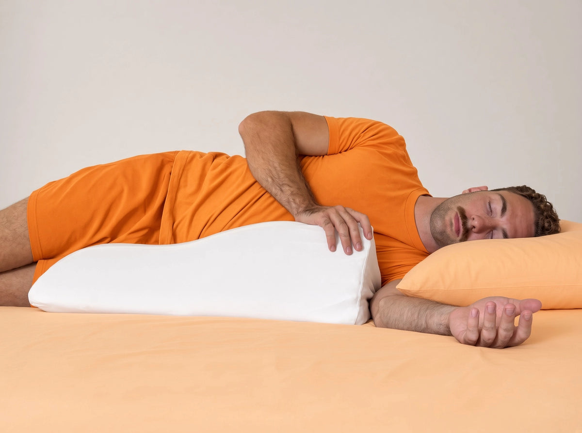 Front view of a side sleeper using the Papaya Pillow for torso support to get relief from shoulder pain.